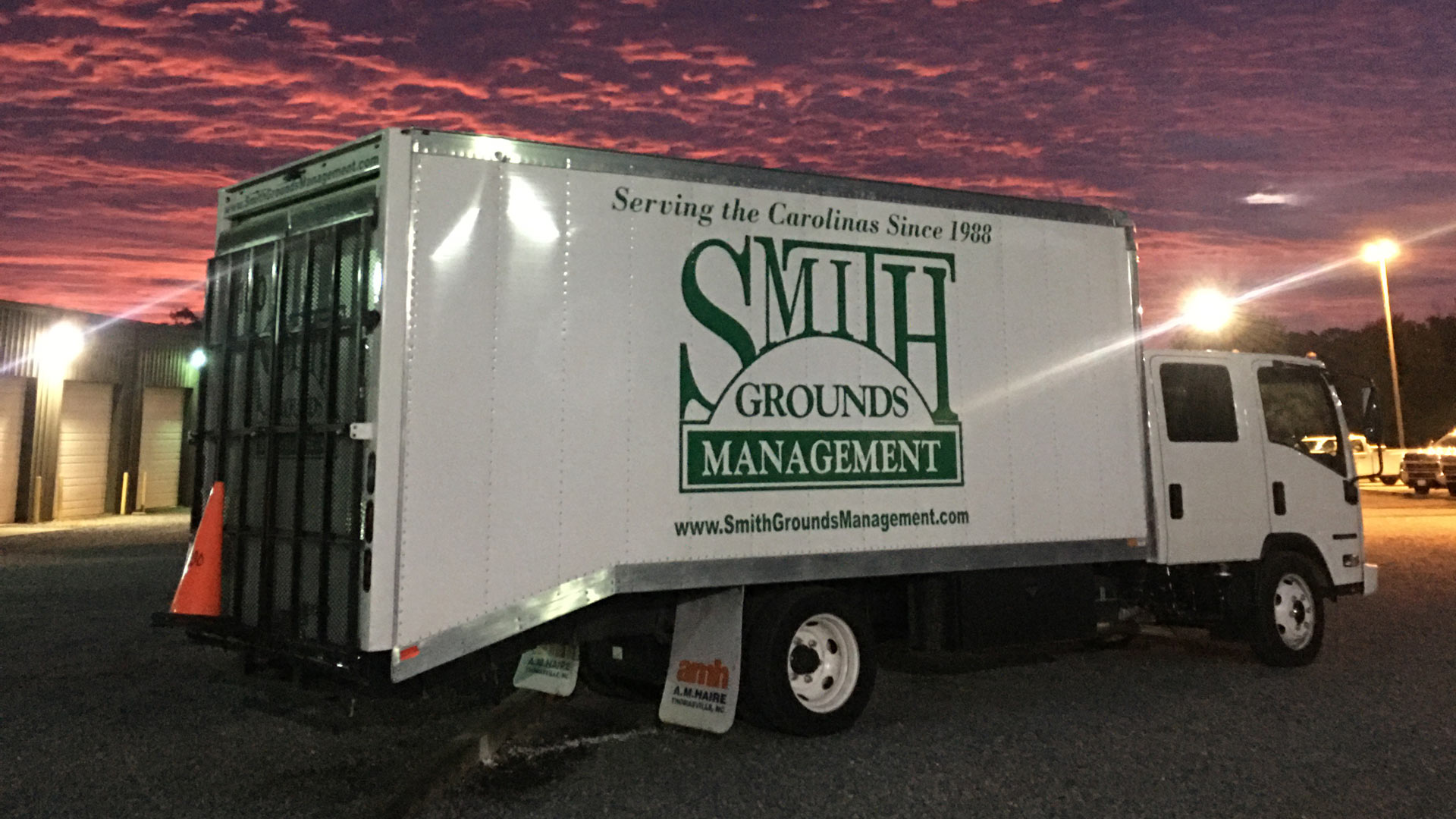 A branded truck for Smith Grounds Management parked in Charlotte, NC.