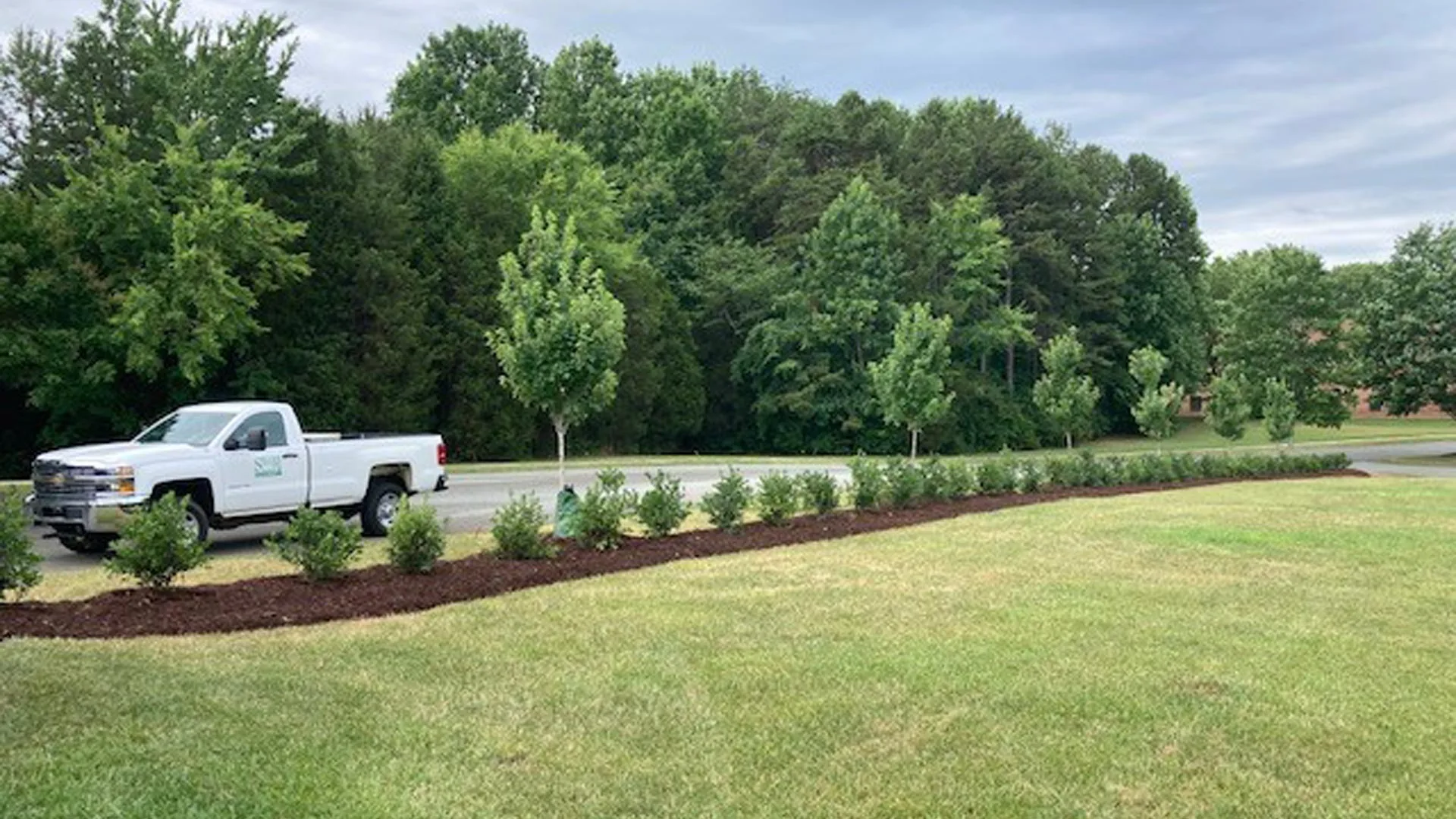 Mulch landscape bed replenished in Charlotte, NC.