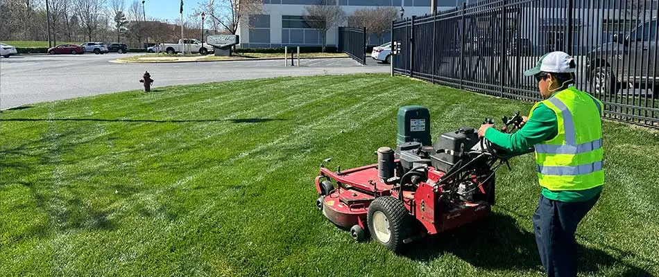 Our team member mowing a commercial clients property.