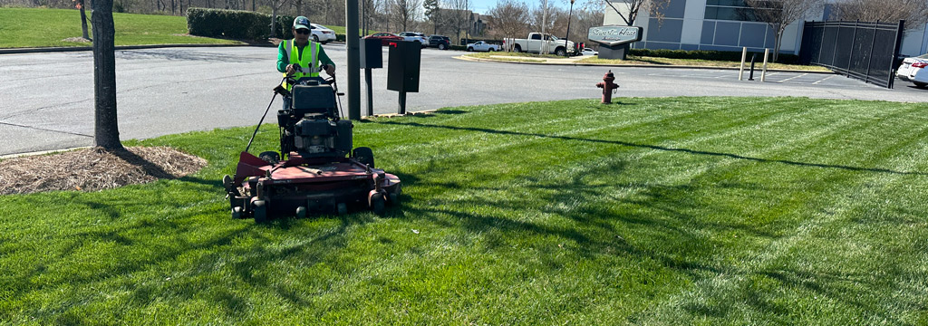 Smith Grounds Management servicing lawn in Pineville, NC.