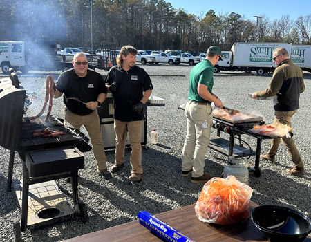 Team members grilling out.